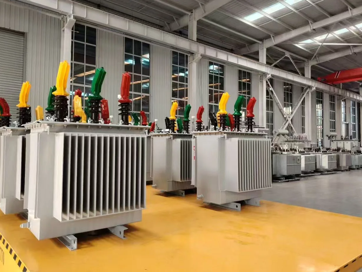 Completed oil-immersed transformers lined up for final checks before delivery