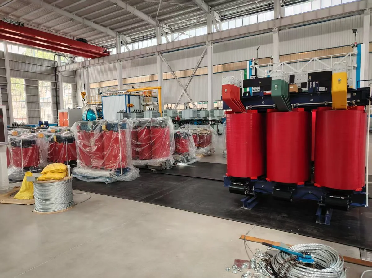 Dry-type transformer coils and assembled units during production